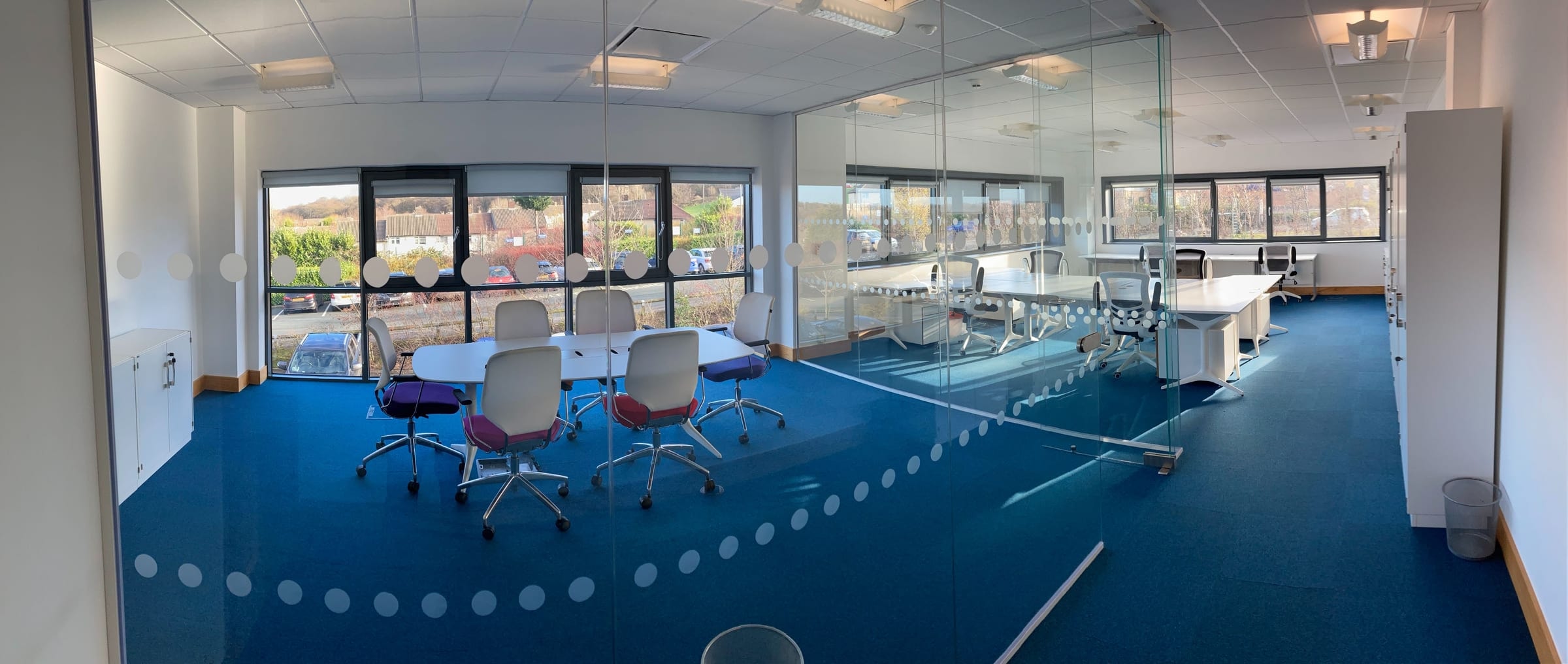 Open-plan area and glass meeting room in the 10-15 person office at Hope Park City Gateway, Bradford